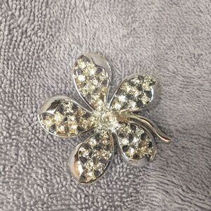 Vintage silver tone and clear rhinestone brooch.
